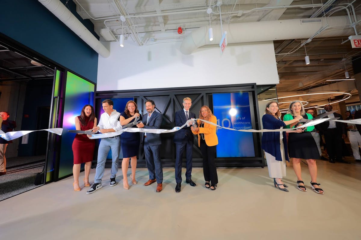 The ribbon cutting officially opening our new office space gallery image